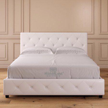 Modern abstract arrangement with geometric shapes on a soft pink surface.